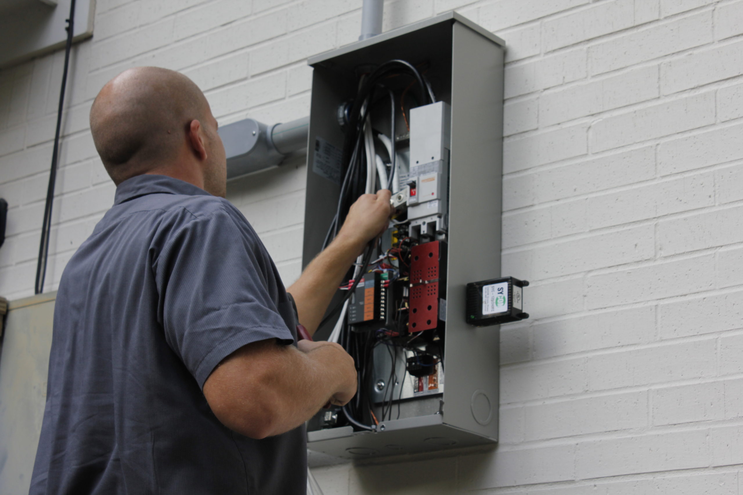 Generator Supercenter electrician working in an electric panel