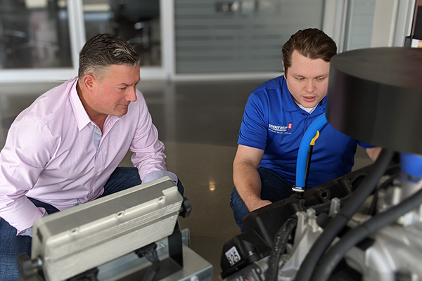 local Generator Supercenter team member showing a customer a generator
