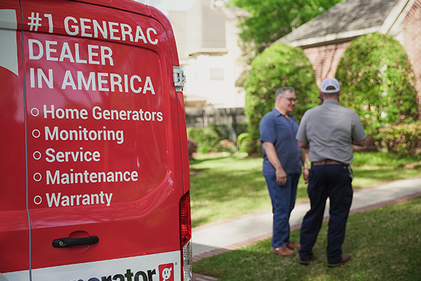 Generator Supercenter of Ocala technician speaking with a customer next to the service van