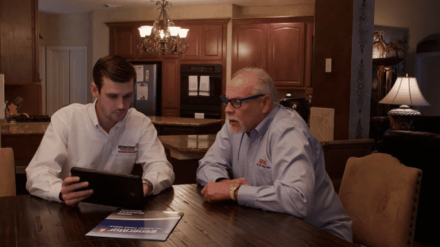 customer sitting with a Generator Supercenter employee discussing financing options